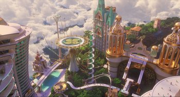 Movie still from “Luck” (2022), directed by Peggy Holmes – An aerial view of a theme park with rides and buildings; Extreme Wide shot, High angle