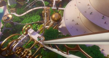 Movie still from “Luck” (2022), directed by Peggy Holmes – An aerial view of a theme park with people walking around it; Extreme Wide shot, Overhead angle