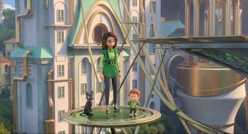 Movie still from “Luck” (2022), directed by Peggy Holmes – A woman and a boy are standing on a platform in front of a building; Wide shot, Low angle