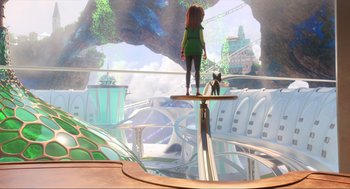 Movie still from “Luck” (2022), directed by Peggy Holmes – A woman standing on a platform in front of a cat; Extreme Wide shot, High angle