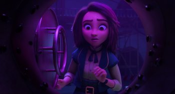 Movie still from “Luck” (2022), directed by Peggy Holmes – A woman holding a steering wheel while standing next to a building; Medium shot, High angle