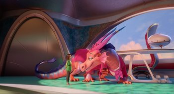 Movie still from “Luck” (2022), directed by Peggy Holmes – A woman standing in front of a giant pink dragon; Wide shot, Over the shoulder angle