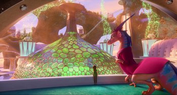 Movie still from “Luck” (2022), directed by Peggy Holmes – A person standing in front of a dragon statue; Extreme Wide shot, Over the shoulder angle