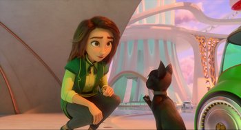 Movie still from “Luck” (2022), directed by Peggy Holmes – A woman sitting on the ground next to a black cat; Medium shot, Over the shoulder angle