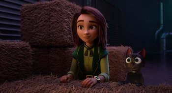 Movie still from “Luck” (2022), directed by Peggy Holmes – A woman sitting on a pile of hay next to an animal; Medium shot, Over the shoulder angle