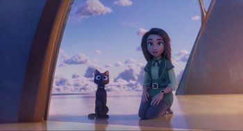 Movie still from “Luck” (2022), directed by Peggy Holmes – A woman sitting on the ground next to a cat; Wide shot, Low angle