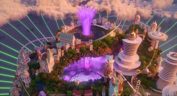 Movie still from “Luck” (2022), directed by Peggy Holmes – An aerial view of an amusement park with purple lights; Extreme Wide shot, High angle