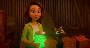 Movie still from “Luck” (2022), directed by Peggy Holmes – A woman holding a jar with a glow in the dark substance in front of a black cat; Medium shot, Over the shoulder angle