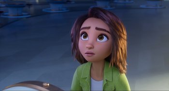 Movie still from “Luck” (2022), directed by Peggy Holmes – A girl with brown hair and a green jacket looking up; Close Up shot, Over the shoulder angle