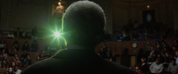 Movie still from “Lucy” (2014), directed by Luc Besson – A man with a beard is looking into the distance; Extreme Close Up shot, Low angle