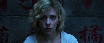 Movie still from “Lucy” (2014), directed by Luc Besson – Scarlett johansson in a scene from the movie under the skin; Close Up shot, Over the shoulder angle