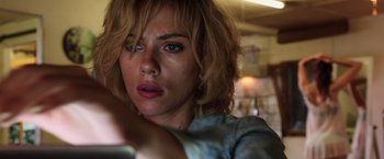 Movie still from “Lucy” (2014), directed by Luc Besson – A person with short blonde hair; Close Up shot, Low angle