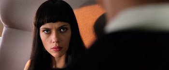 Movie still from “Lucy” (2014), directed by Luc Besson – A person wearing a black shirt; Close Up shot, Low angle
