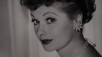 Movie still from “Lucy and Desi” (2022), directed by Amy Poehler – A woman's face in a black - and - white photo; Extreme Close Up shot, Low angle