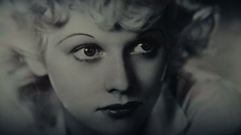 Movie still from “Lucy and Desi” (2022), directed by Amy Poehler – A woman's face in a black and white photo; Extreme Close Up shot, Overhead angle