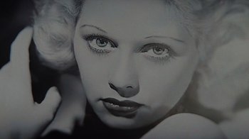 Movie still from “Lucy and Desi” (2022), directed by Amy Poehler – A black and white photo of a woman's face; Extreme Close Up shot, High angle