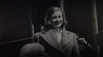 Movie still from “Lucy and Desi” (2022), directed by Amy Poehler – An old photo of a woman with a cat in her lap; Close Up shot, Low angle