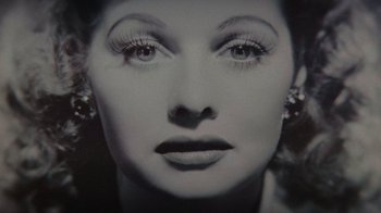Movie still from “Lucy and Desi” (2022), directed by Amy Poehler – The face of a woman with long eyelashes; Extreme Close Up shot, Overhead angle
