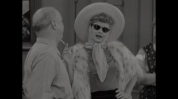 Movie still from “Lucy and Desi” (2022), directed by Amy Poehler – An old photo of a man and a woman; Medium shot, Over the shoulder angle