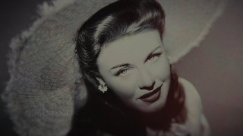 Movie still from “Lucy and Desi” (2022), directed by Amy Poehler – An old photo of a woman with a flower in her hair; Close Up shot, Low angle