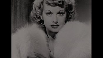 Movie still from “Lucy and Desi” (2022), directed by Amy Poehler – A black and white photo of a woman with a fur coat; Close Up shot, Overhead angle