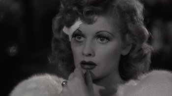 Movie still from “Lucy and Desi” (2022), directed by Amy Poehler – An old black and white photo of a woman; Close Up shot, High angle