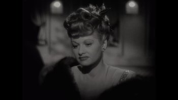 Movie still from “Lucy and Desi” (2022), directed by Amy Poehler – A black - and - white photo of a woman in a dress; Close Up shot, Over the shoulder angle