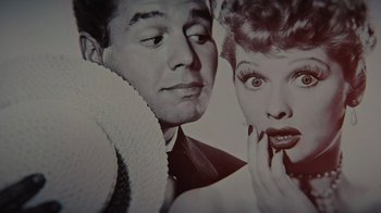 Movie still from “Lucy and Desi” (2022), directed by Amy Poehler – An old black and white photo of a man and a woman; Extreme Close Up shot, Overhead angle
