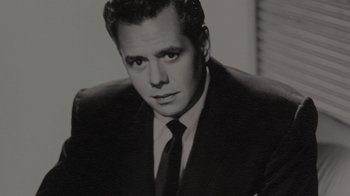 Movie still from “Lucy and Desi” (2022), directed by Amy Poehler – Black and white photograph of a man in a suit and tie; Close Up shot, Low angle