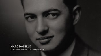 Movie still from “Lucy and Desi” (2022), directed by Amy Poehler – A black and white photo of a young man; Close Up shot, Overhead angle