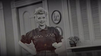 Movie still from “Lucy and Desi” (2022), directed by Amy Poehler – A black - and - white photo of a woman smiling; Medium shot, Low angle