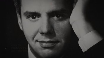 Movie still from “Lucy and Desi” (2022), directed by Amy Poehler – A black and white photo of a man's face; Extreme Close Up shot, Low angle