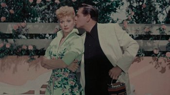 Movie still from “Lucy and Desi” (2022), directed by Amy Poehler – A man and a woman standing next to each other; Medium shot, High angle