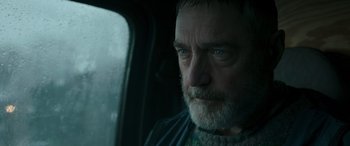 Movie still from “Luther: The Fallen Sun” (2023), directed by Jamie Payne – A person in a car; Close Up shot, Low angle