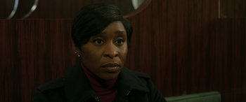 Movie still from “Luther: The Fallen Sun” (2023), directed by Jamie Payne – A black woman with short black hair wearing a black jacket; Close Up shot, High angle