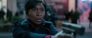 Movie still from “Luther: The Fallen Sun” (2023), directed by Jamie Payne – A person looking at the camera; Close Up shot, High angle