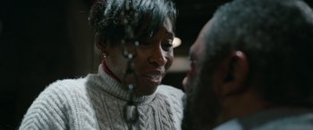 Movie still from “Luther: The Fallen Sun” (2023), directed by Jamie Payne – An older man and a younger woman are talking to each other; Close Up shot, Over the shoulder angle