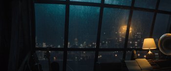 Movie still from “Lyle, Lyle, Crocodile” (2022), directed by Will Speck – A view of a city at night through a window; Medium shot, Over the shoulder angle