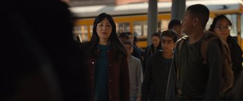 Movie still from “Lyle, Lyle, Crocodile” (2022), directed by Will Speck – A group of people walking on a sidewalk; Medium shot, Over the shoulder angle