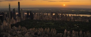 Movie still from “Lyle, Lyle, Crocodile” (2022), directed by Will Speck – The sun is setting over a large city; Extreme Wide shot, High angle