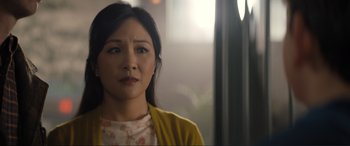 Movie still from “Lyle, Lyle, Crocodile” (2022), directed by Will Speck – A woman with a yellow jacket looking at the camera; Close Up shot, Over the shoulder angle