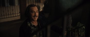 Movie still from “Lyle, Lyle, Crocodile” (2022), directed by Will Speck – A man sitting in front of a window; Medium shot, Over the shoulder angle