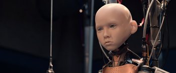 Movie still from “M3GAN” (2022), directed by Gerard Johnstone – A mannequin with a face and head in the middle of a room; Close Up shot, Low angle