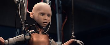Movie still from “M3GAN” (2022), directed by Gerard Johnstone – The head of a robot doll; Close Up shot, Low angle