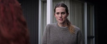 Movie still from “M3GAN” (2022), directed by Gerard Johnstone – A person wearing a sweater; Close Up shot, Over the shoulder angle