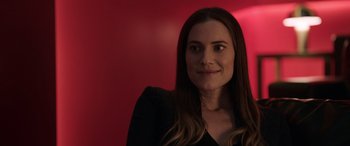 Movie still from “M3GAN” (2022), directed by Gerard Johnstone – A woman with long brown hair wearing a black dress; Close Up shot, Over the shoulder angle