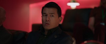 Movie still from “M3GAN” (2022), directed by Gerard Johnstone – A person wearing a suit; Close Up shot, Over the shoulder angle