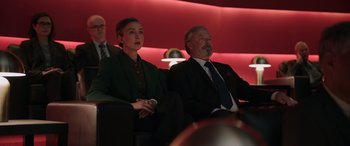 Movie still from “M3GAN” (2022), directed by Gerard Johnstone – A man and a woman are sitting in a theater; Medium shot, Low angle