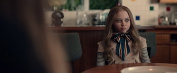Movie still from “M3GAN” (2022), directed by Gerard Johnstone – A girl sitting at a table in front of a mirror; Close Up shot, Over the shoulder angle