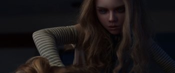 Movie still from “M3GAN” (2022), directed by Gerard Johnstone – A woman with long brown hair is looking at the camera; Close Up shot, Low angle